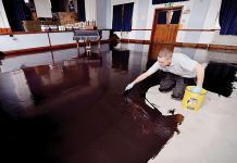 Smoothing subfloors before applying a waterproof surface membrane